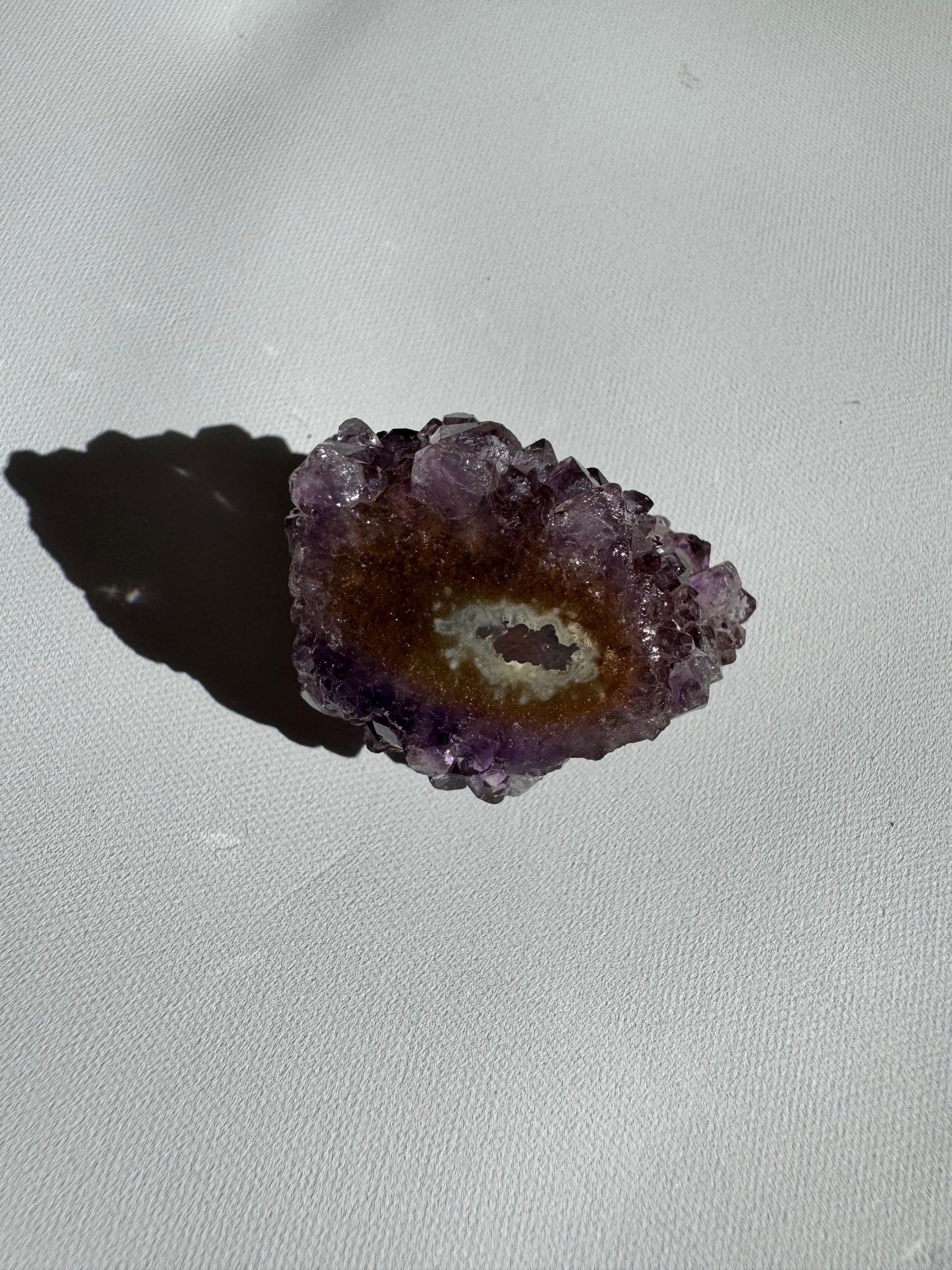 Small Amethyst Crystal Stalactite Grade A with subtle purple and brown hues, showcasing natural crystal growth and geode texture.