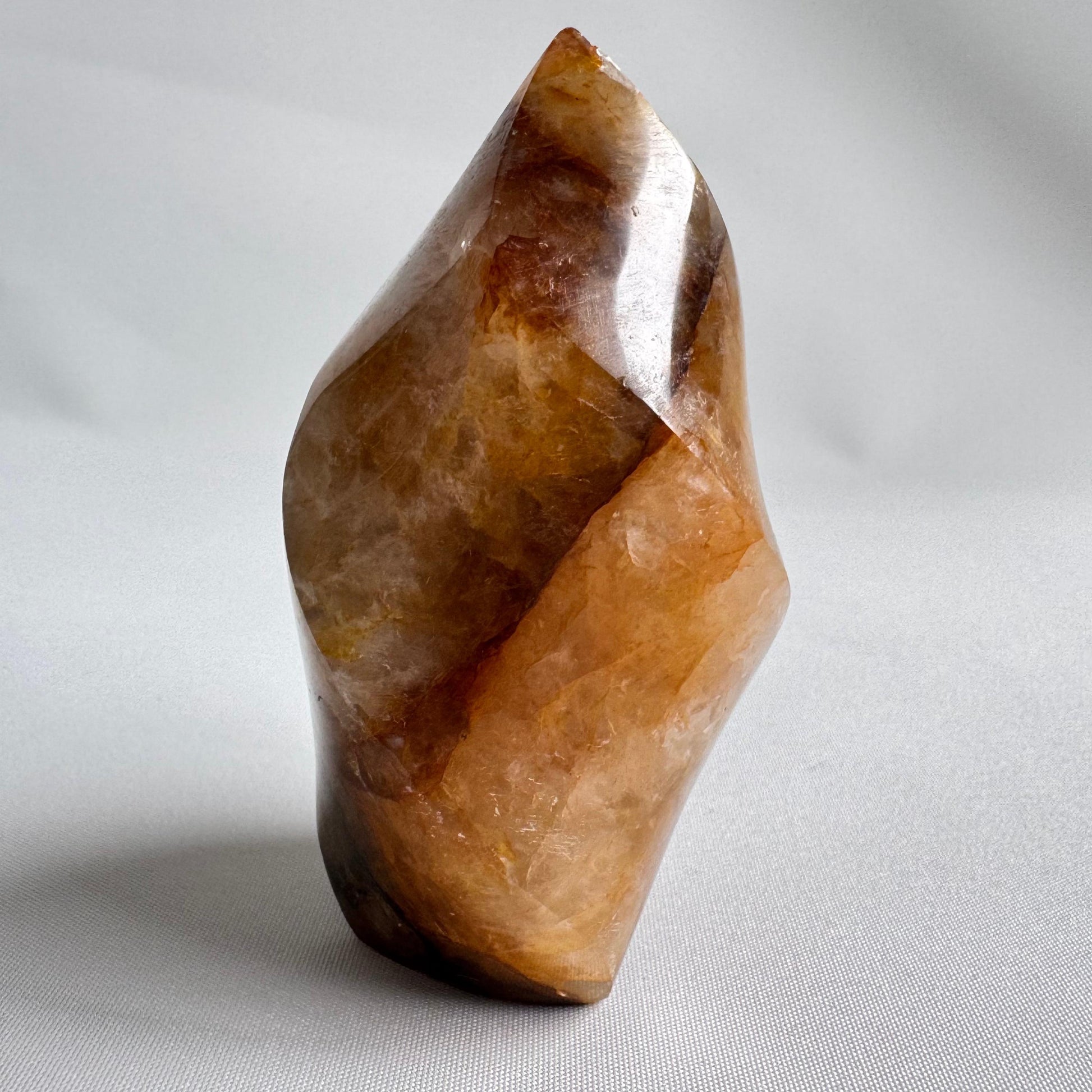 Polished Golden Healer Flame gemstone featuring natural golden hues and swirling patterns, perfect for collectors and healing crystal enthusiasts.