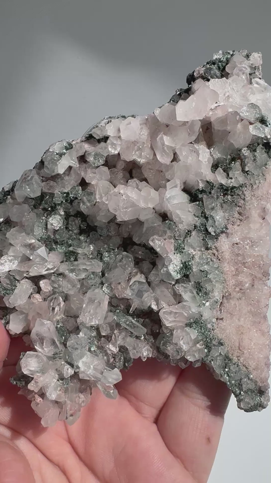 Close-up of Pink Lithium Quartz Cluster showcasing detailed Lemurian striations and calming crystal formations for spiritual wellness use.