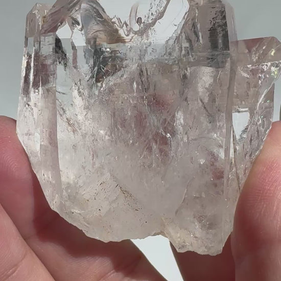 Close-up of Silver Light Lemurian Seed Crystal #5 held in hand, showcasing its clarity and natural formation. Ideal Lemurian Quartz for intuitive practices.